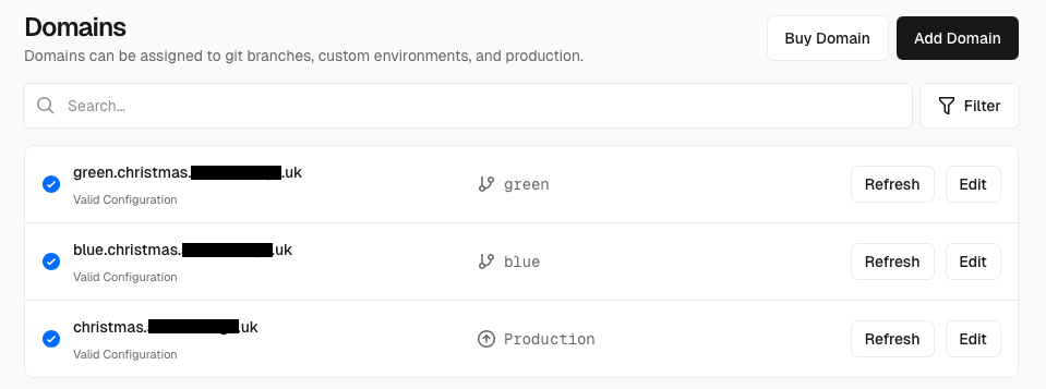 Vercel domain settings showing two domains linked to different branches